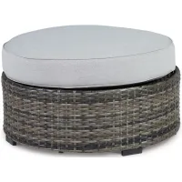 Harbor Court Ottoman with Cushion in Black by Ashley Furniture