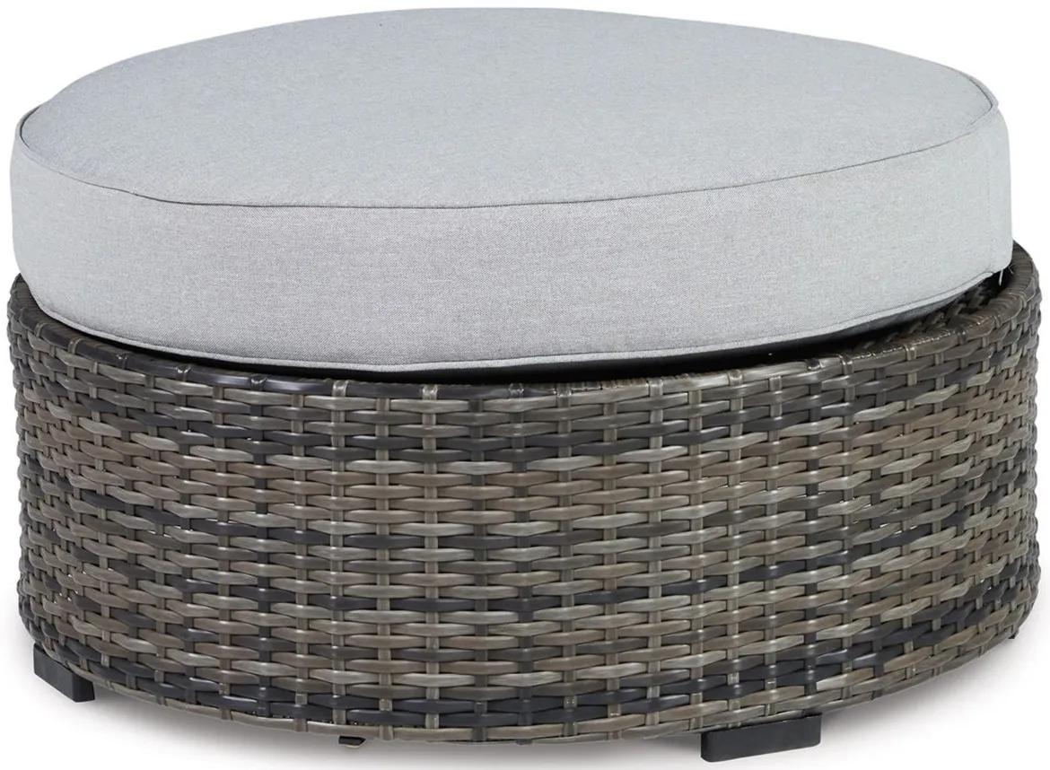 Harbor Court Ottoman with Cushion in Gray by Ashley Furniture