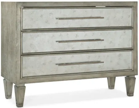Melange Tercia Three-Drawer Chest in Silver leaf case with eglomise glass drawer fronts and silver thin bar pulls by Hooker Furniture