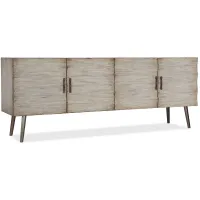 Melange Truxton Credenza in Distressed almond painted finish with satin nickel textured metal bar pulls and metal legs by Hooker Furniture