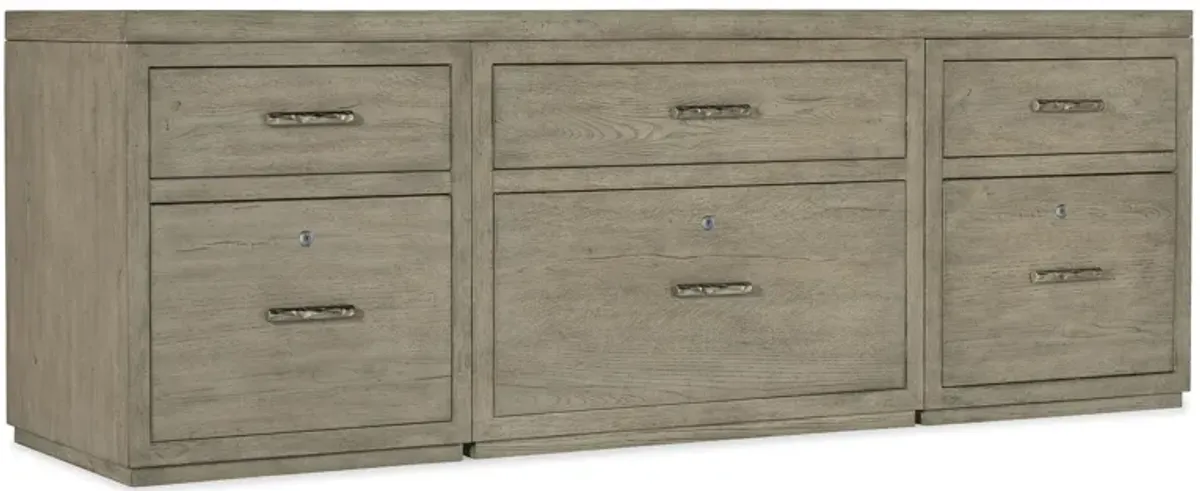 Linville Falls 84" Credenza in Mink: A soft smoked gray finish. Textured metal bar pulls in an antique pewter finish. by Hooker Furniture