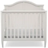 Parker Mini Baby Crib with Mattress and Two Sheets by Delta Children in Bianca White by Delta Children
