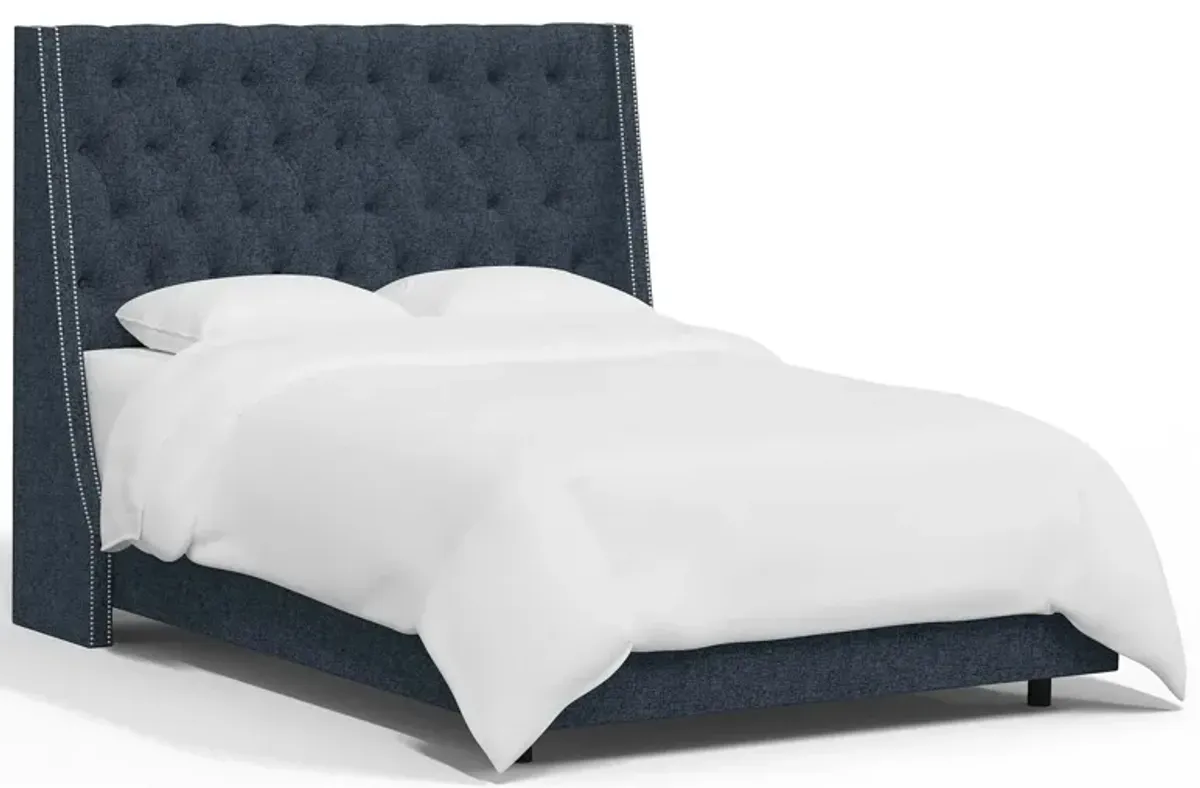 Sheridan Wingback Bed in Zuma Navy by Skyline