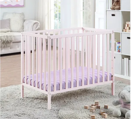 Palmer 3-in-1 Convertible Mini Crib W/ Mattress Pad in Pastel Pink by Heritage Baby
