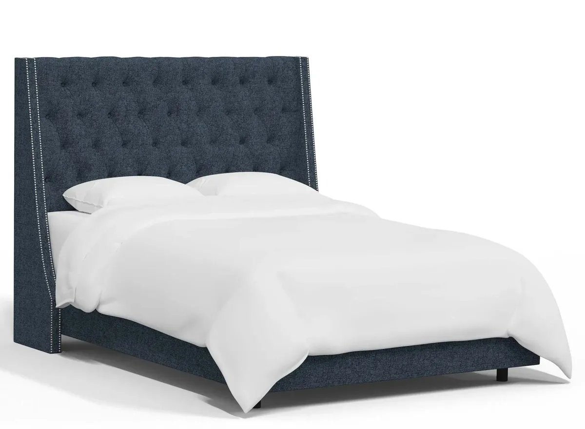 Sheridan Wingback Bed in Zuma Navy by Skyline