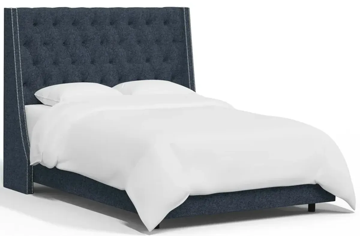 Sheridan Wingback Bed in Zuma Navy by Skyline