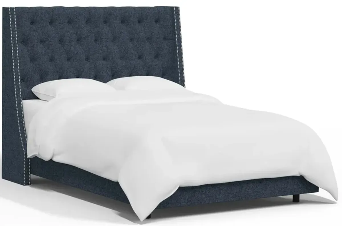 Sheridan Wingback Bed in Zuma Navy by Skyline