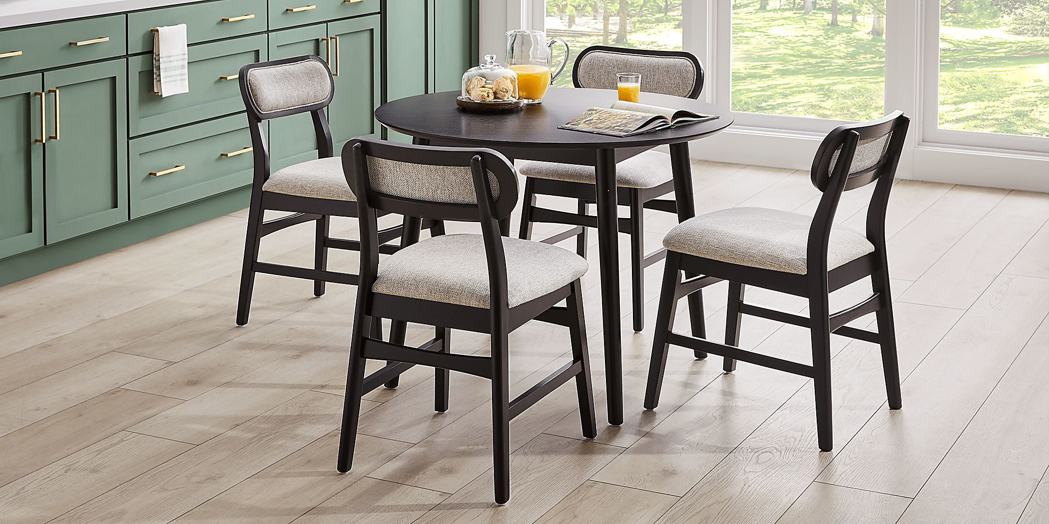 Watertown Black 5 Pc Round Dining Room with Upholstered Chairs