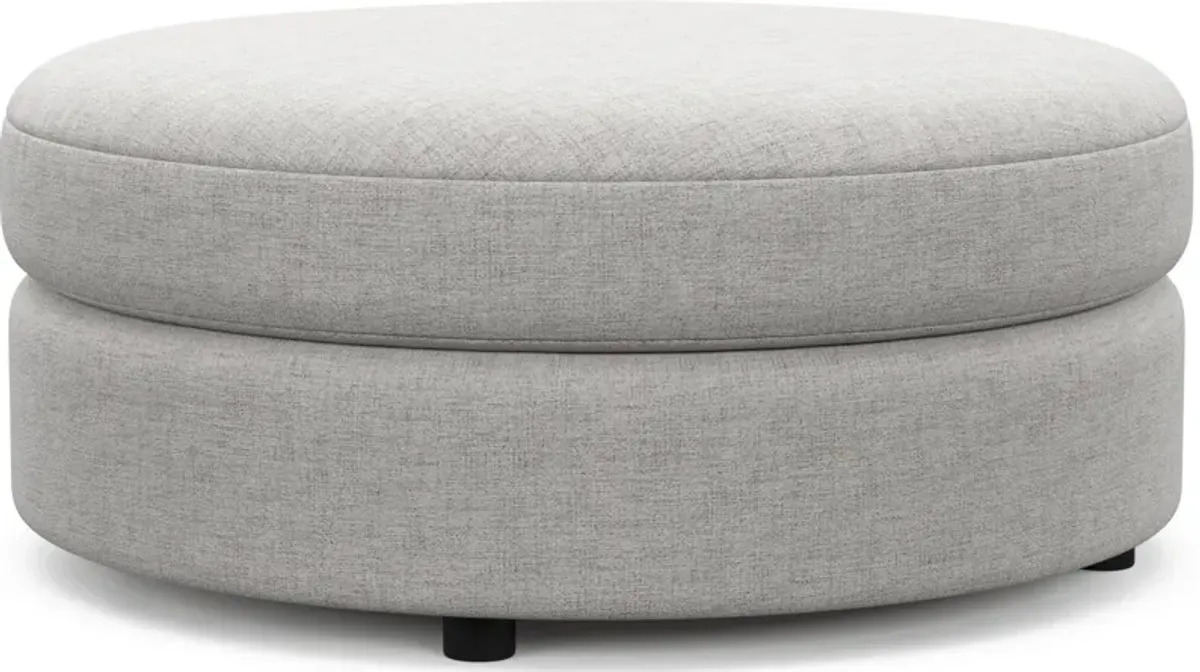 Allegra Foam Comfort Round Ottoman - Adario Fog